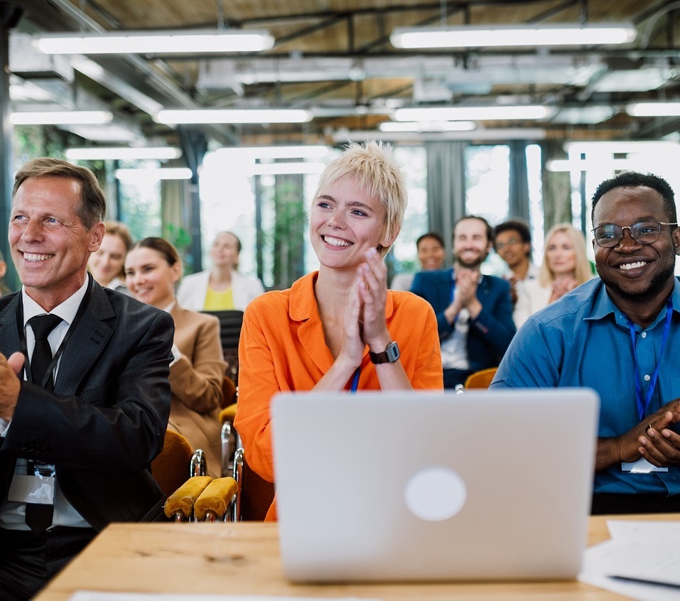 Cinematic image of a conference meeting. Business people sitting in a room listening to the motivator coach. Representation of a Self growth and improvement special event